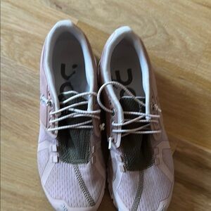 On Running Pink Athletic Shoes with Lightweight Design and Supportive Cushioning